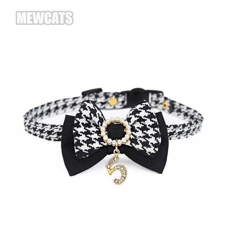744ef091320f75c417cef7792427dd8825eb46ca8ee942966a5fff57f8b89607.jpg Classic Bow Cat Collar Black and White - Image 1